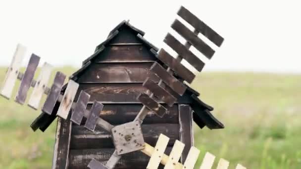 Old weathered decorative wooden windmill - Imágenes, Vídeo