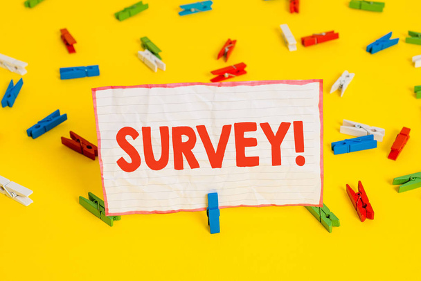 Conceptual hand writing showing Survey. Business photo text research method used for collecting data from a predefined group Colored clothespin papers empty reminder yellow floor office. - Photo, Image