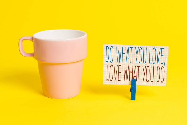 Word writing text Do What You Love Love What You Do. Business concept for you able doing stuff you enjoy it to work in better places then Cup empty paper blue clothespin rectangle shaped reminder - Foto, afbeelding