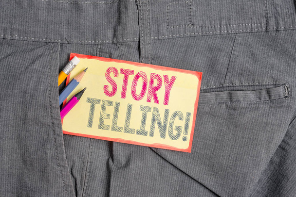 Conceptual hand writing showing Story Telling. Business photo showcasing activity writing stories for publishing them to public Writing equipment and yellow notepaper in pocket of trousers. - Photo, Image