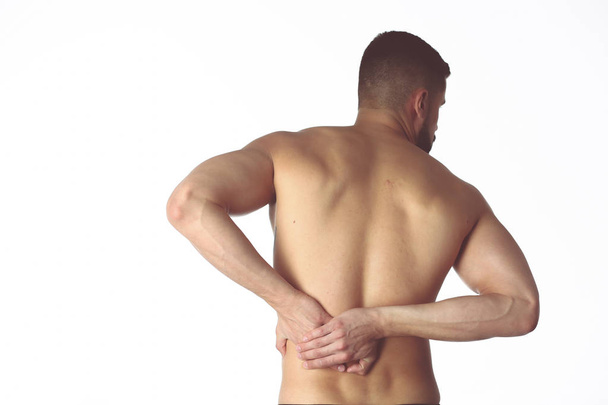 Young man holding his neck in pain. Medical concept - Foto, imagen