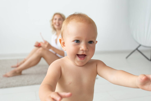 children, people, infancy and age concept - beautiful happy baby at home - Photo, Image