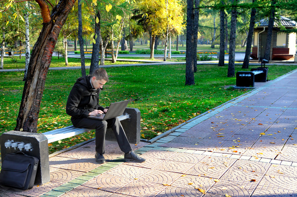 Man with Laptop at the Park - Фото, зображення