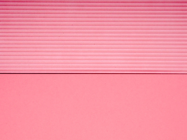 pink corrugated paper as background, copy space for text - Fotó, kép