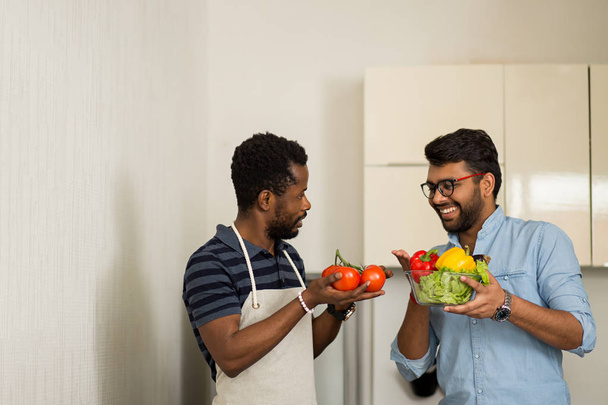 Handsome men standing in kitchen - Foto, afbeelding