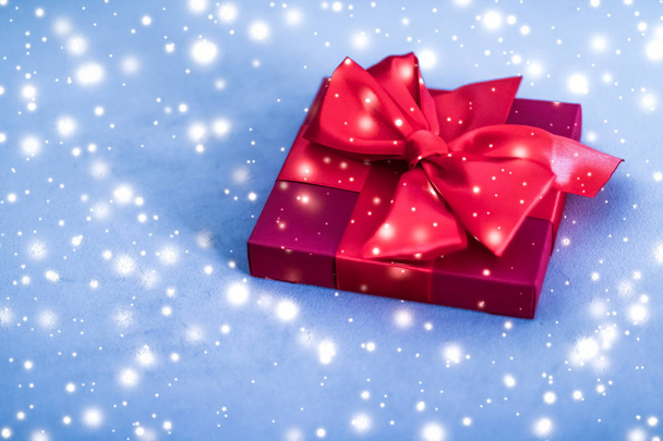 Christmas holiday luxury red gift box on blue background with gl - Photo, Image