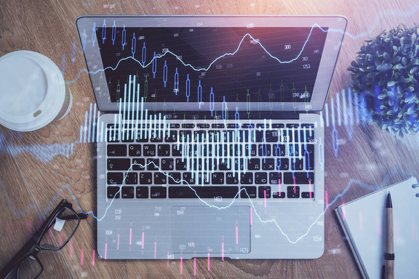 Double exposure of graph and financial info and work space with computer background. Concept of international online trading. - Фото, изображение