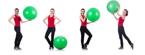 スイスのボールで運動する若い女性 - 写真・画像