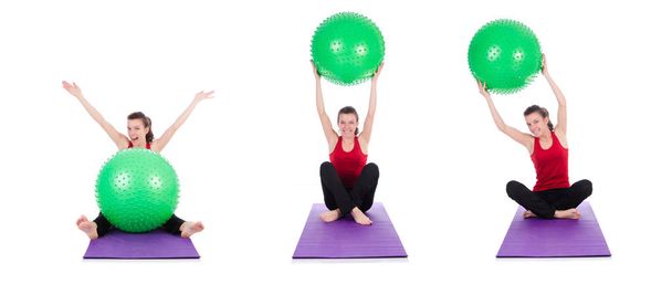 Young woman exercising with swiss ball - Фото, изображение