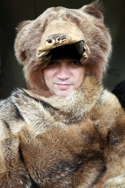 Man in fur hat and cape - Фото, зображення