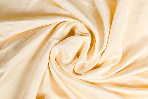 Fondo suave de tela de seda beige liso. Textura de tela.  - Foto, Imagen