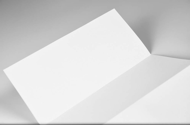 Blank Folded Letter, Letterhead, or Flyer over Grey Background - Foto, Imagen
