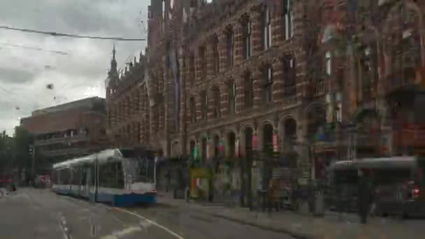 Amsterdam město oblačné den hlavní tramvaj silniční výlet zadek POV Panorama 4 k timuplynout Nizozemsko - Záběry, video