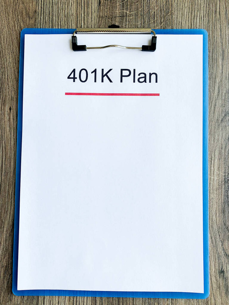 Paper with 401k plan on wood table - Photo, Image