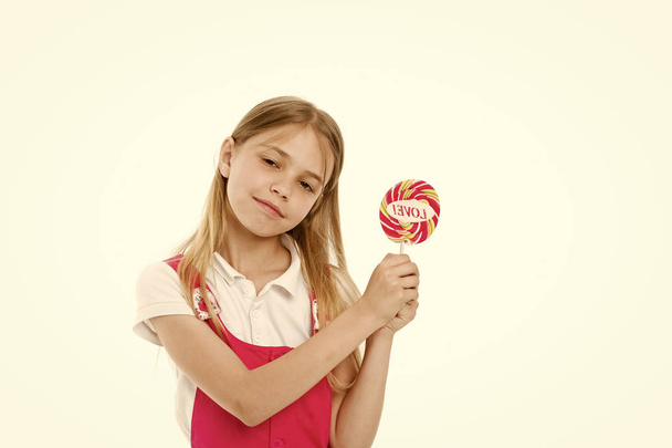 Girl with lollipop isolated on white. Little child hold candy with love lettering. Sweet beauty and look. Valentines day romance. Candyshop concept. Childhood and happiness. Sharing sweet love - Fotografie, Obrázek
