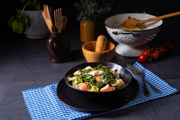 pappardelle pasta with creamed spinach and fried salmon - Photo, image