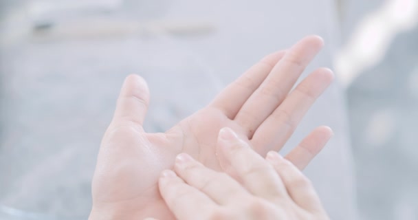 woman dropping moisturizer in hand - Video, Çekim