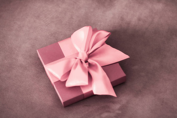 Vintage luxury holiday blush pink gift box with silk ribbon and  - Photo, Image