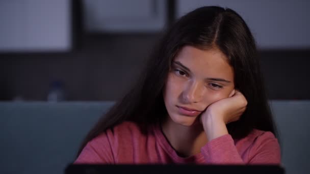 young sleepy woman looks at black computer display - Materiał filmowy, wideo