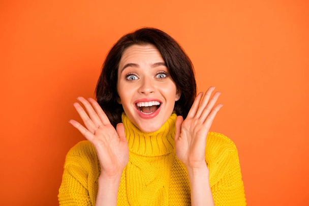 Photo of fascinating shocked impressed funny girl seeing something unbelievable while isolated with orange background - Foto, Imagen