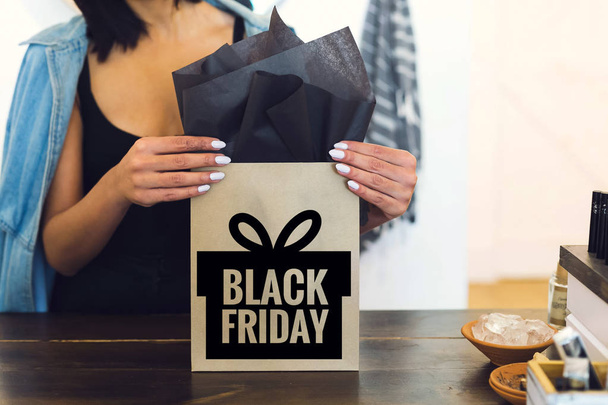 Shopping woman holding Black Friday paper bags stock photo - Photo, Image