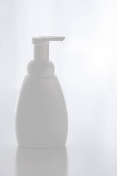 Organic natural cosmetic for baby, plastic bottle of bath cream, shampoo, lotion, shower gel, body milk on white background. Mockup. - Photo, Image