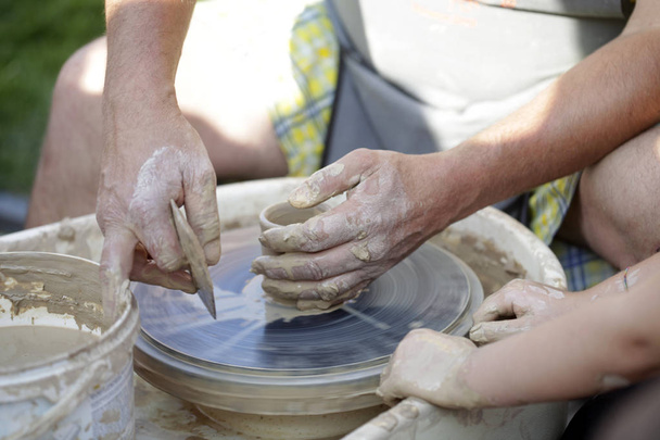 master hands on potter's wheel  - Photo, Image