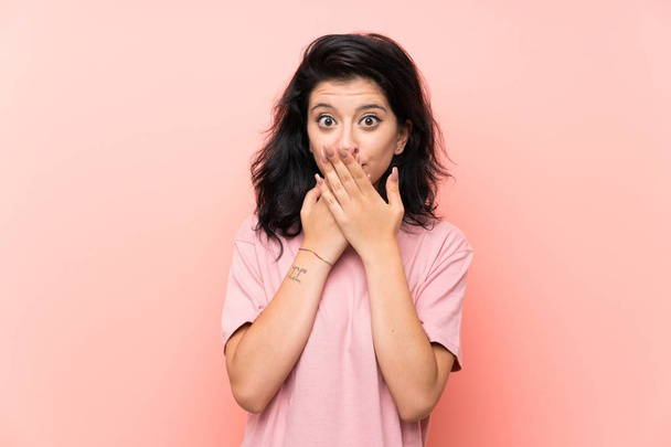 Young woman over isolated pink background with surprise facial expression - Fotoğraf, Görsel