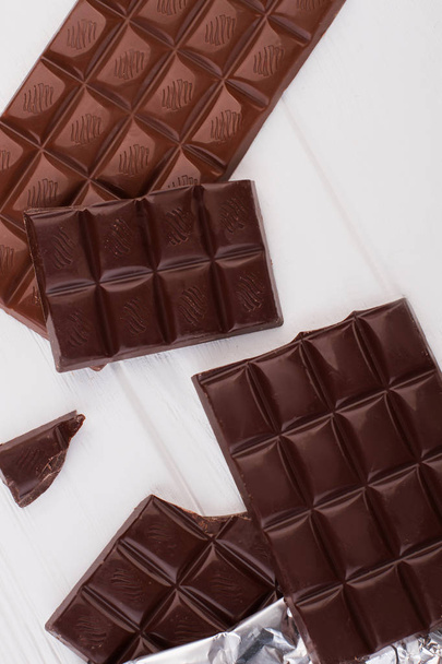 Chocolate bar on white background, top view. - Photo, Image