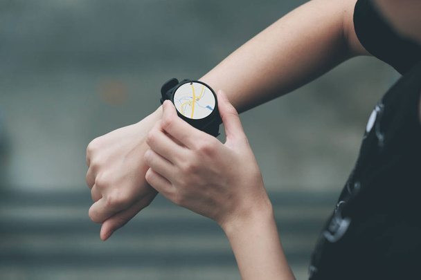 The girl uses the smart watch to see the navigation map. - Photo, Image