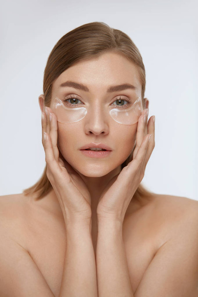 Eye skin care. Woman with beauty patch mask under eyes portrait - Zdjęcie, obraz