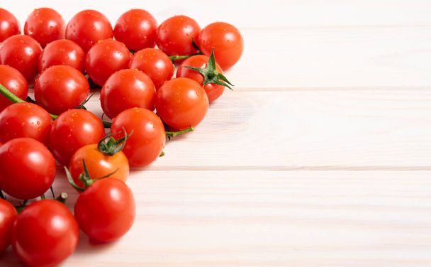 Cherry tomatoes on the white wooden table - Foto, immagini