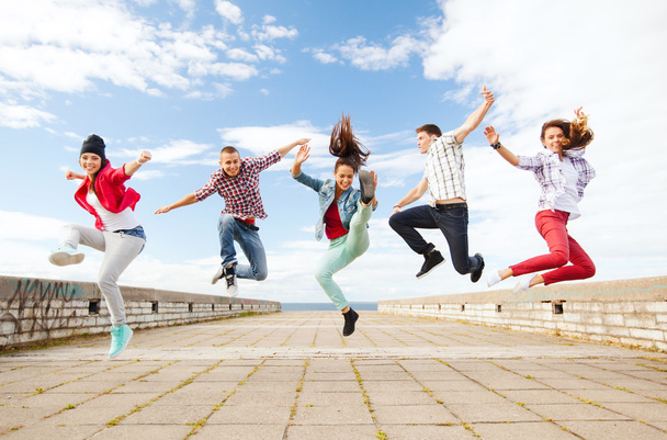Group of teenagers jumping - Fotó, kép