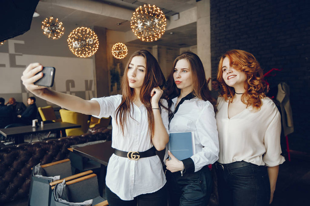 three businesswomen in a cafe - Fotoğraf, Görsel