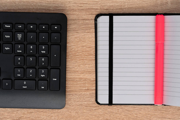 Keyboard and notebook with electric pink pen - Fotografie, Obrázek