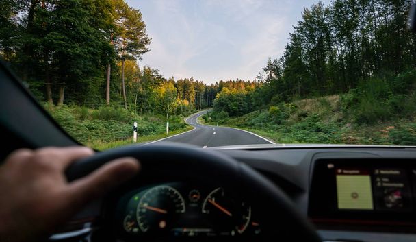 hands of car driver on steering wheel, road trip, driving on hig - Fotoğraf, Görsel