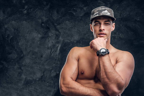 Portrait of shirtless muscular man over dark background - Photo, Image