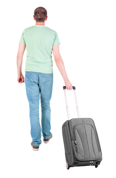 back view of walking man with suitcase. - Φωτογραφία, εικόνα