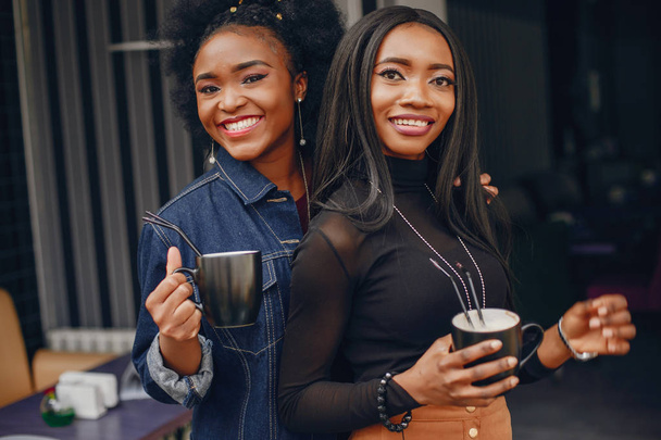 two pretty girls in a cafe - Photo, Image
