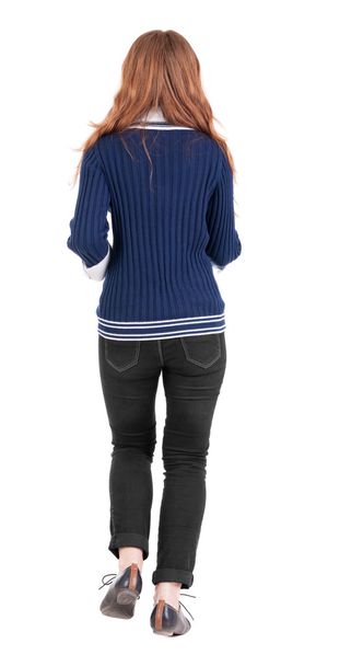 back view of jumping woman in jeans. - Φωτογραφία, εικόνα
