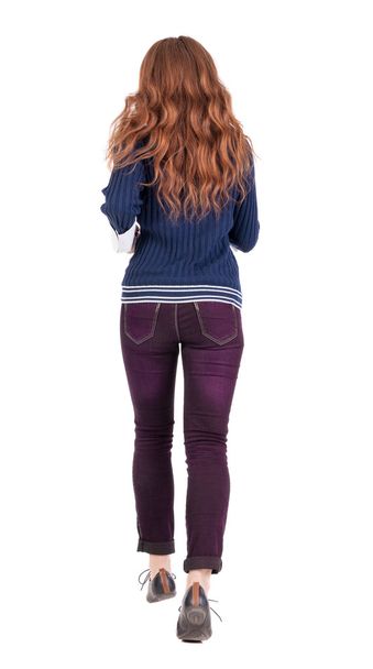 back view of jumping woman in jeans. - Photo, image
