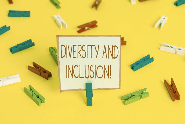 Conceptual hand writing showing Diversity And Inclusion. Business photo showcasing range huanalysis difference includes race ethnicity gender Colored clothespin papers empty reminder yellow floor - Photo, Image