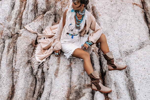 young tribal style woman with lot of boho accessories  - 写真・画像