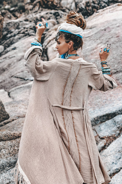 young tribal style woman with lot of boho accessories outdoors - Valokuva, kuva