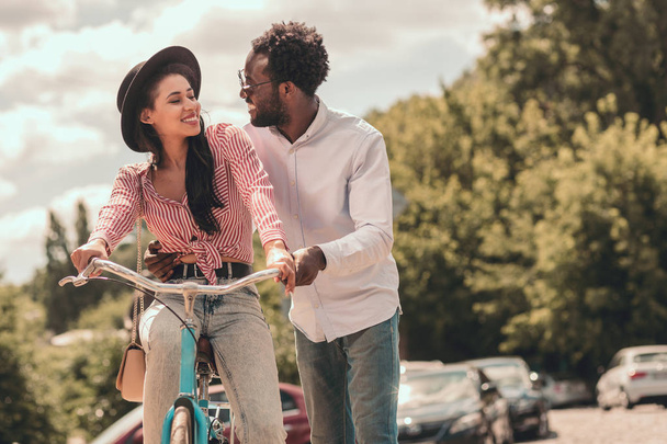 Cheerful lady on the bike smiling to her boyfriend. Website banner - Foto, Imagem