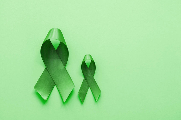 Lime Green Ribbons on green background, Mental health awareness  - Zdjęcie, obraz