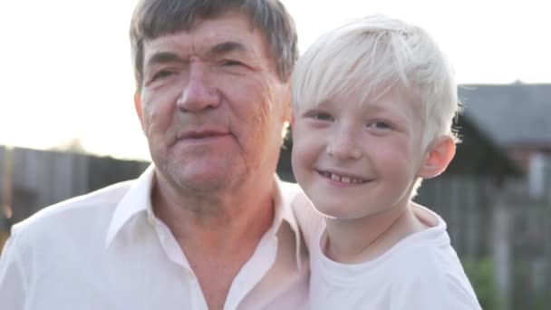 Close-up of grandfather with grandson at daughter on sunset background. - Footage, Video
