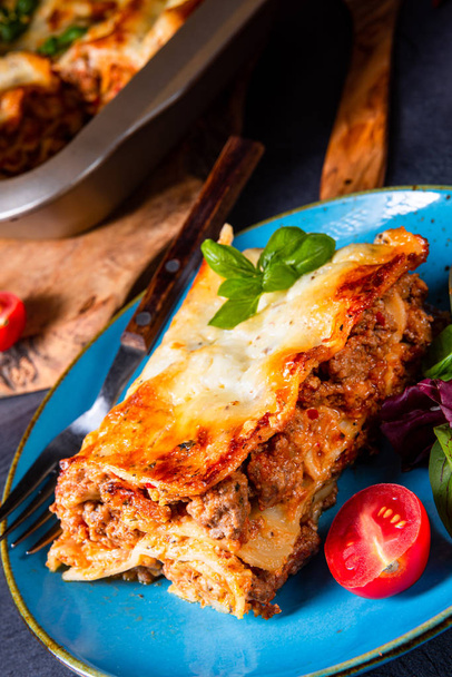 spicy lasagne with tomato sauce and basil - Photo, Image