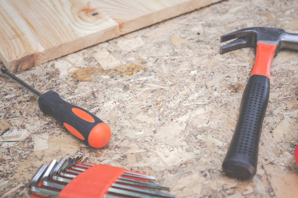Construction tools placed on wooden floors. - Photo, Image