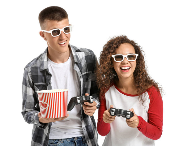 Teenagers playing video game on white background - Foto, Bild